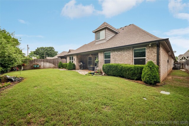 10350 E 122nd St S, Bixby, OK 74008 - back of house with brick siding, roof with shingles, and a patio