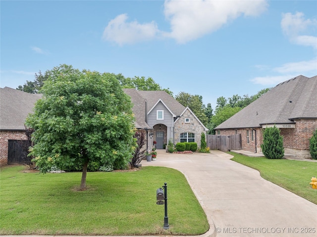 10350 E 122nd St S, Bixby, OK 74008 - view of front facade featuring concrete driveway, brick siding, and stone siding