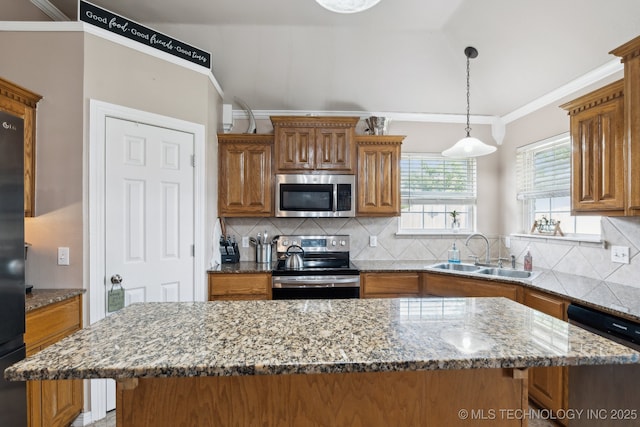 13 Cedar St, Kiefer, OK 74041 - kitchen featuring stainless steel appliances, a sink, brown cabinetry, decorative backsplash, and crown molding