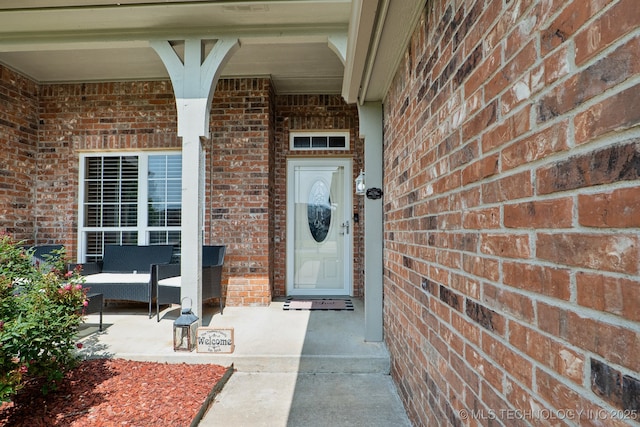13 Cedar St, Kiefer, OK 74041 - doorway to property featuring brick siding and a porch