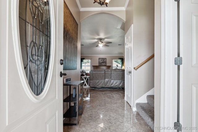 13 Cedar St, Kiefer, OK 74041 - entryway with crown molding, stairway, a ceiling fan, arched walkways, and marble finish floors