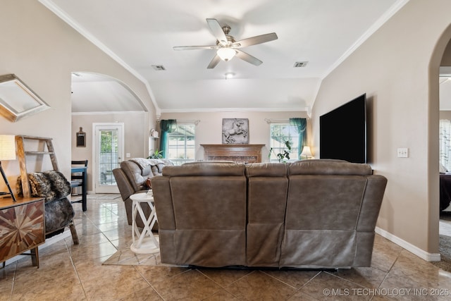 13 Cedar St, Kiefer, OK 74041 - living area featuring arched walkways, ceiling fan, lofted ceiling, crown molding, and baseboards