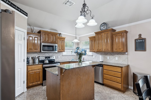 13 Cedar St, Kiefer, OK 74041 - kitchen with appliances with stainless steel finishes, dark stone countertops, backsplash, a center island, and vaulted ceiling