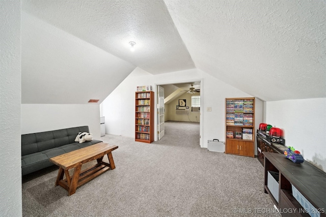 321 W 50th Pl, Sand Springs, OK 74063 - carpeted living room with a textured ceiling and lofted ceiling