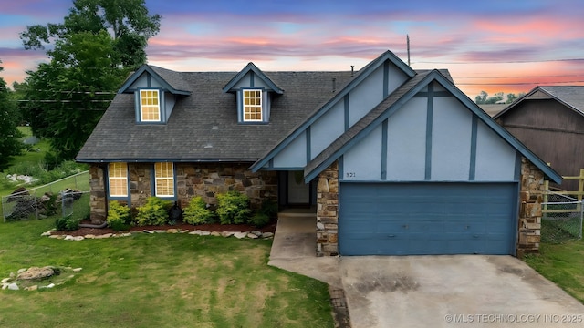 321 W 50th Pl, Sand Springs, OK 74063 - view of front of home featuring stone siding, stucco siding, driveway, a garage, and roof with shingles