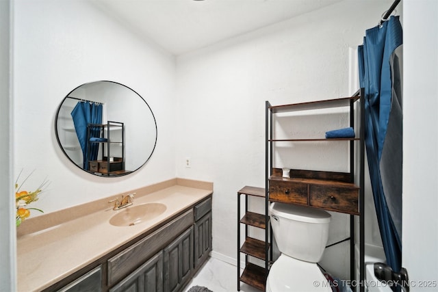321 W 50th Pl, Sand Springs, OK 74063 - bathroom featuring vanity, toilet, baseboards, and marble look tile flooring