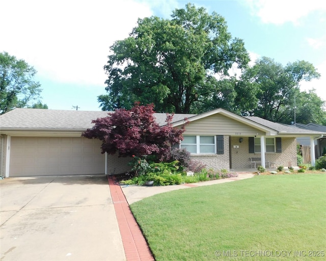 6619 E 57th St, Tulsa, OK 74145 - ranch-style house with a garage, brick siding, a front lawn, driveway, and covered porch