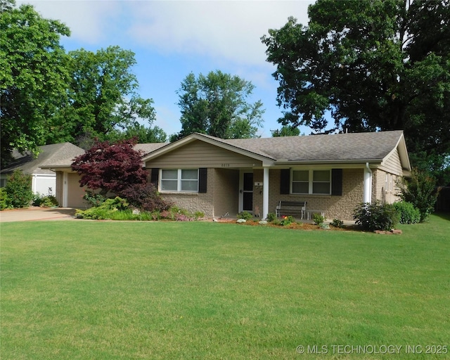 6619 E 57th St, Tulsa, OK 74145 - single story home with brick siding, a front yard, an attached garage, and driveway