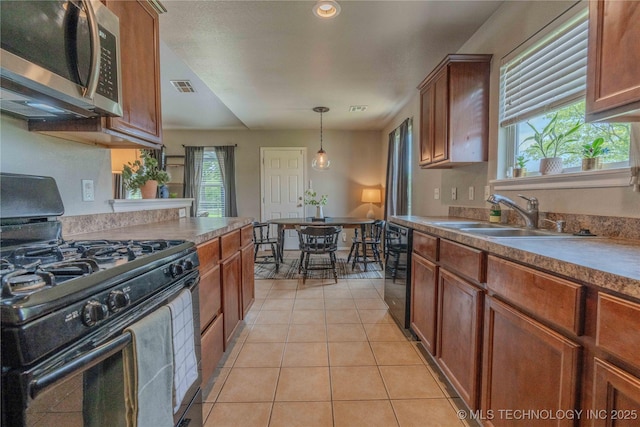 2800 N 20th St, Broken Arrow, OK 74012 - kitchen featuring black appliances, a sink, light tile patterned floors, pendant lighting, and recessed lighting