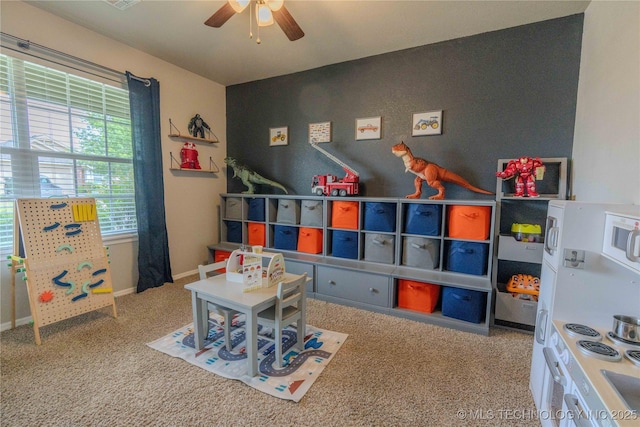 2800 N 20th St, Broken Arrow, OK 74012 - rec room featuring a ceiling fan, carpet floors, baseboards, and an accent wall