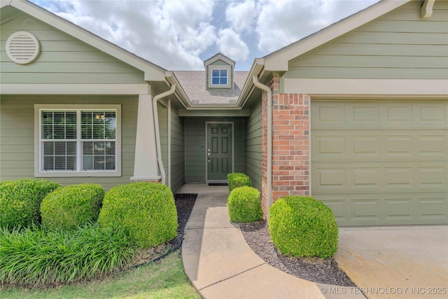 2800 N 20th St, Broken Arrow, OK 74012 - property entrance featuring brick siding, a garage, and roof with shingles