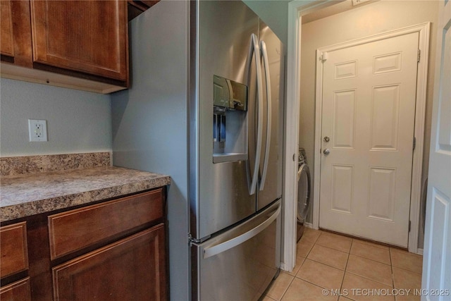 2800 N 20th St, Broken Arrow, OK 74012 - kitchen featuring stainless steel refrigerator with ice dispenser, light tile patterned floors, and washer / clothes dryer