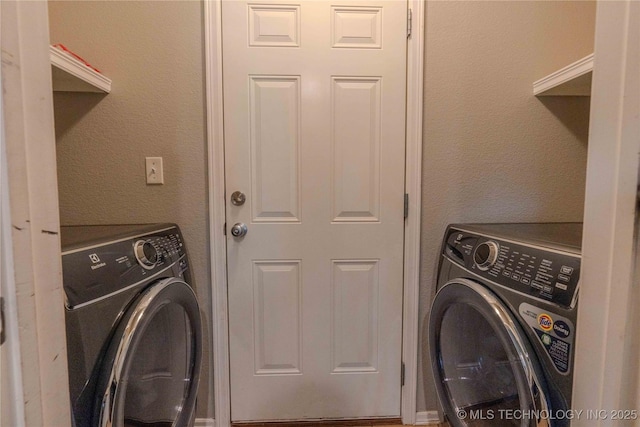 2800 N 20th St, Broken Arrow, OK 74012 - laundry area featuring washing machine and clothes dryer and a textured wall