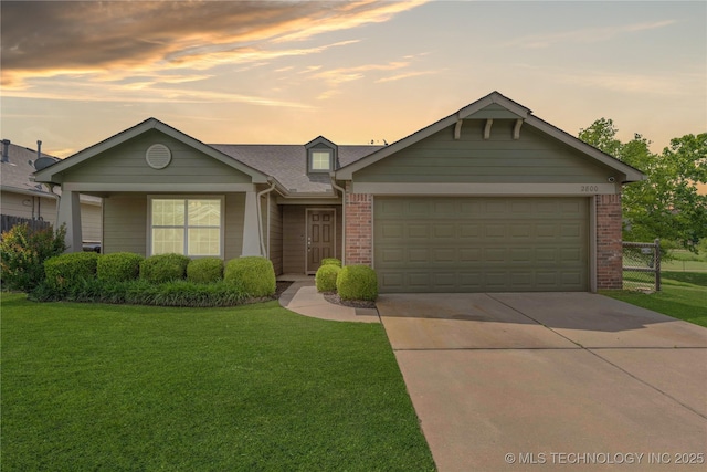 2800 N 20th St, Broken Arrow, OK 74012 - view of front facade featuring driveway, a garage, a front lawn, brick siding, and roof with shingles