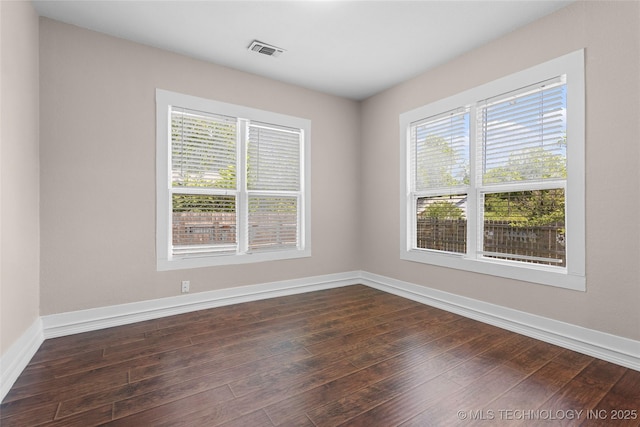 700 D St NW, Ardmore, OK 73401 - unfurnished room with dark wood finished floors and baseboards
