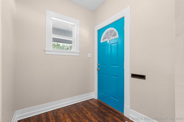 700 D St NW, Ardmore, OK 73401 - entrance foyer featuring dark wood finished floors and baseboards