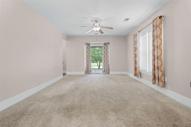 700 D St NW, Ardmore, OK 73401 - carpeted spare room with a ceiling fan and baseboards