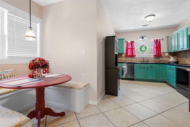 700 D St NW, Ardmore, OK 73401 - kitchen with dishwasher, range with electric stovetop, healthy amount of natural light, and tasteful backsplash