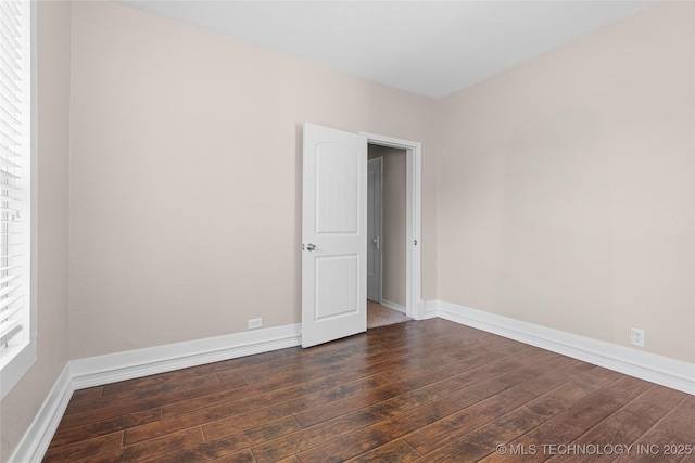 700 D St NW, Ardmore, OK 73401 - spare room featuring wood finished floors and baseboards