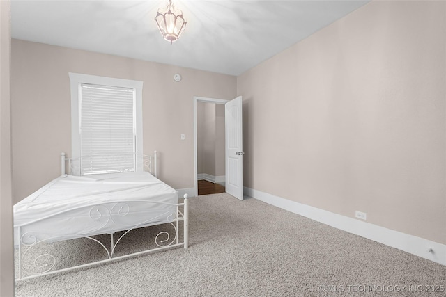 700 D St NW, Ardmore, OK 73401 - bedroom featuring carpet and baseboards