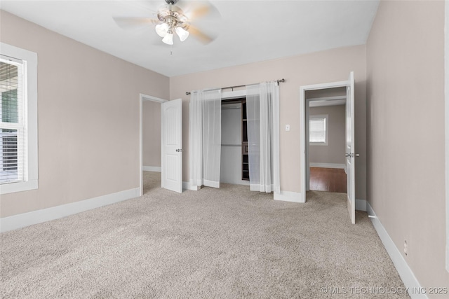 700 D St NW, Ardmore, OK 73401 - unfurnished bedroom featuring carpet, a closet, and ceiling fan