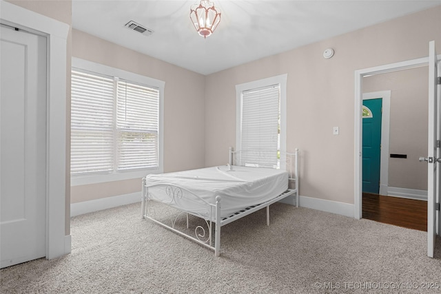 700 D St NW, Ardmore, OK 73401 - carpeted bedroom with baseboards