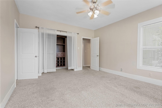700 D St NW, Ardmore, OK 73401 - unfurnished bedroom with carpet floors and a ceiling fan