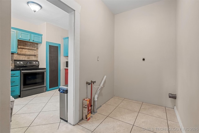 700 D St NW, Ardmore, OK 73401 - laundry room featuring light tile patterned floors