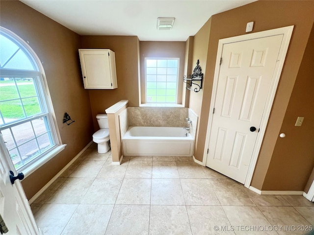 915 Aspenwood St, Cleveland, OK 74020 - bathroom with a bath, toilet, baseboards, and tile patterned flooring
