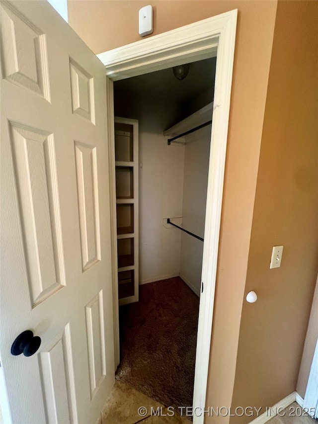 915 Aspenwood St, Cleveland, OK 74020 - walk in closet featuring carpet flooring