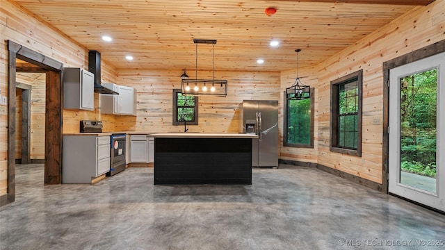 4396 E Cheadle Rd, Milburn, OK 73450 - kitchen with appliances with stainless steel finishes, wall chimney range hood, finished concrete flooring, light countertops, and wood walls