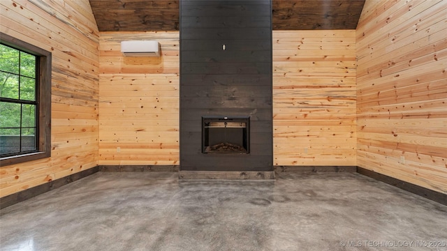 4396 E Cheadle Rd, Milburn, OK 73450 - unfurnished living room with concrete flooring, wood walls, a glass covered fireplace, and baseboards