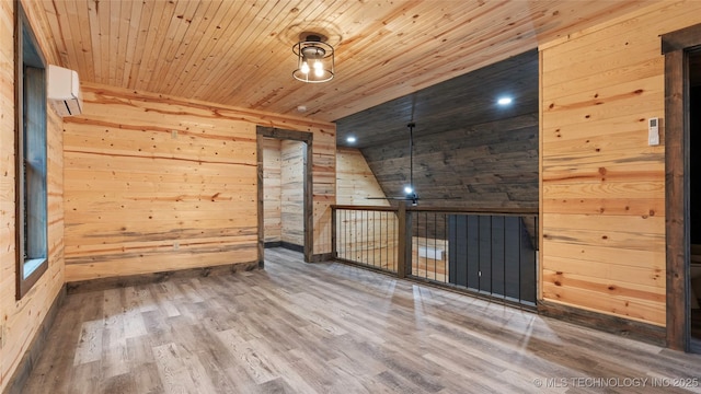 4396 E Cheadle Rd, Milburn, OK 73450 - spare room with wooden walls, a wall unit AC, wood ceiling, lofted ceiling, and wood finished floors