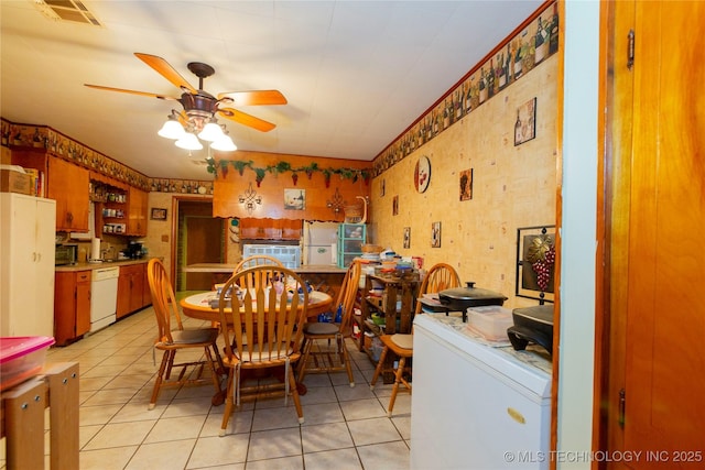 200 S K St, Quinton, OK 74561 - dining area featuring a ceiling fan, light tile patterned floors, and wallpapered walls