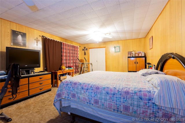 200 S K St, Quinton, OK 74561 - bedroom featuring carpet and wooden walls
