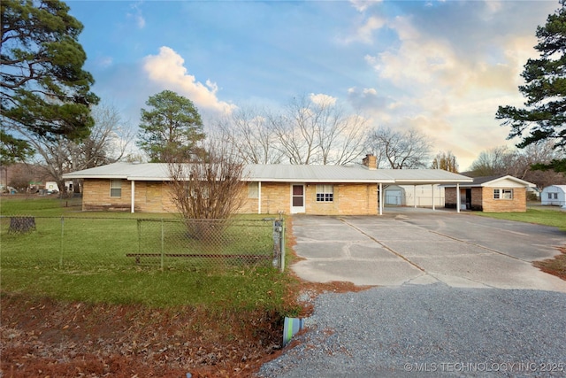 200 S K St, Quinton, OK 74561 - ranch-style home featuring driveway, a chimney, metal roof, a carport, and brick siding