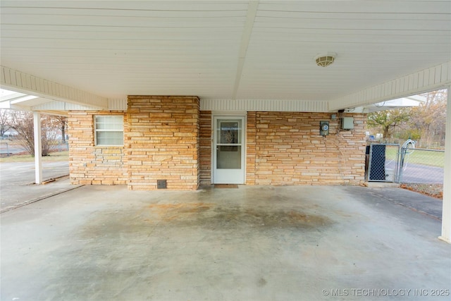 200 S K St, Quinton, OK 74561 - view of patio / terrace featuring a carport