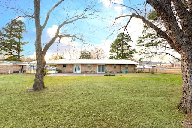 200 S K St, Quinton, OK 74561 - rear view of house featuring a patio area, central AC, and brick siding