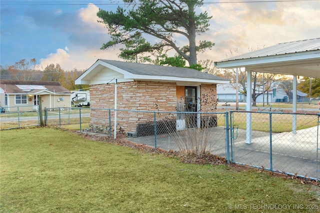 200 S K St, Quinton, OK 74561 - property exterior at dusk featuring brick siding