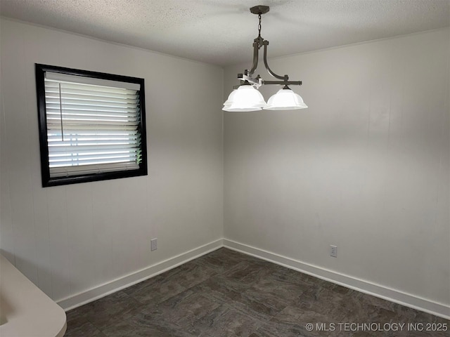 1950 Cimmaron, Wilson, OK 73463 - spare room with a textured ceiling and baseboards