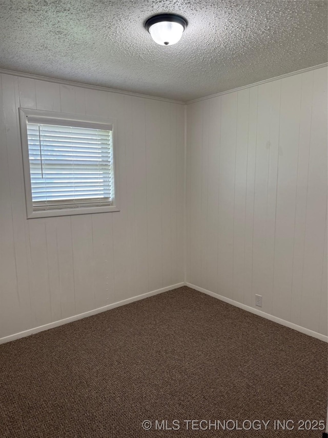 1950 Cimmaron, Wilson, OK 73463 - spare room featuring a textured ceiling and carpet