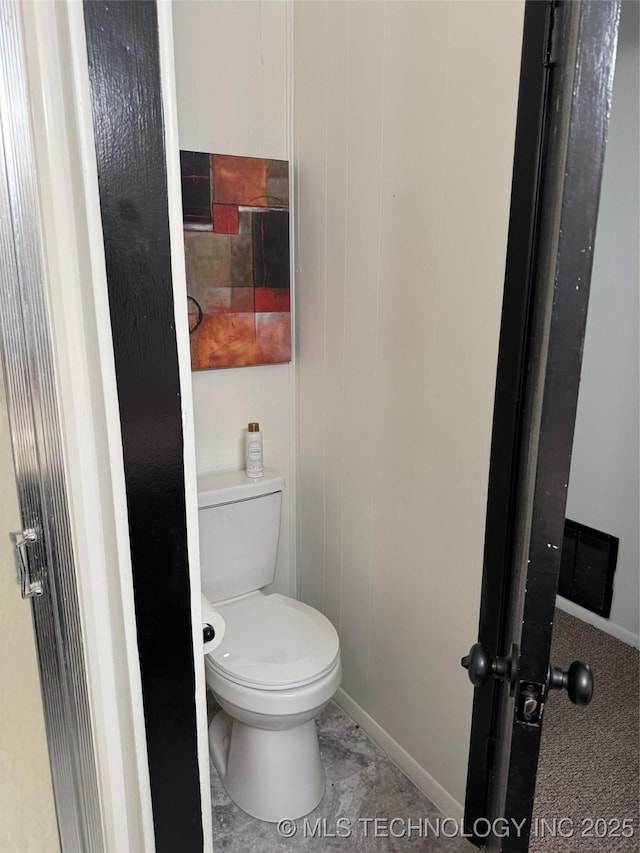 1950 Cimmaron, Wilson, OK 73463 - bathroom with toilet and baseboards
