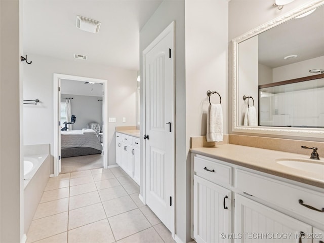 2505 S Willow Ave, Broken Arrow, OK 74012 - ensuite bathroom featuring vanity, a garden tub, tile patterned flooring, and an enclosed shower