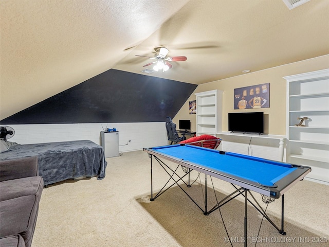 2505 S Willow Ave, Broken Arrow, OK 74012 - rec room featuring carpet floors, a ceiling fan, built in features, a textured ceiling, and vaulted ceiling