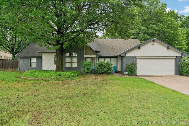 8713 S 77th E Ave, Tulsa, OK 74133 - view of front facade with an attached garage, concrete driveway, brick siding, and a shingled roof