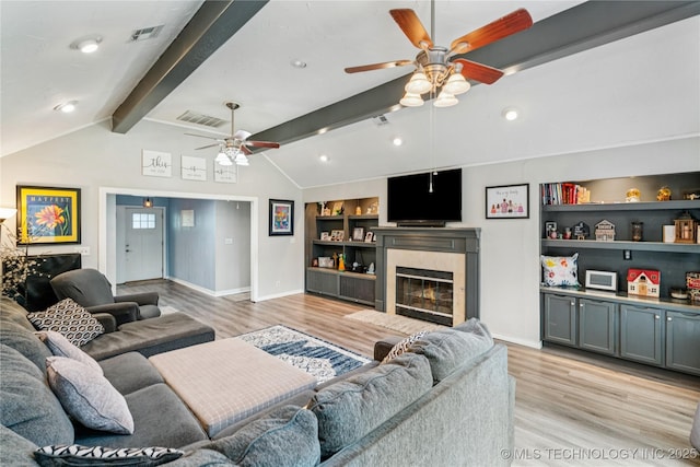 8713 S 77th E Ave, Tulsa, OK 74133 - living area featuring ceiling fan, light wood-type flooring, baseboards, and built in shelves