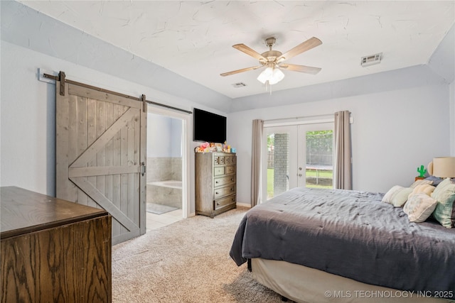 8713 S 77th E Ave, Tulsa, OK 74133 - carpeted bedroom with access to outside, french doors, a barn door, connected bathroom, and ceiling fan