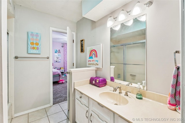 8713 S 77th E Ave, Tulsa, OK 74133 - bathroom with vanity, a shower with door, tile patterned flooring, ensuite bath, and baseboards