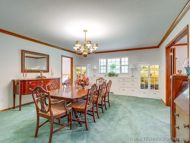 121 W 17th St, Ada, OK 74820 - dining area with a chandelier, carpet floors, ornamental molding, and baseboards