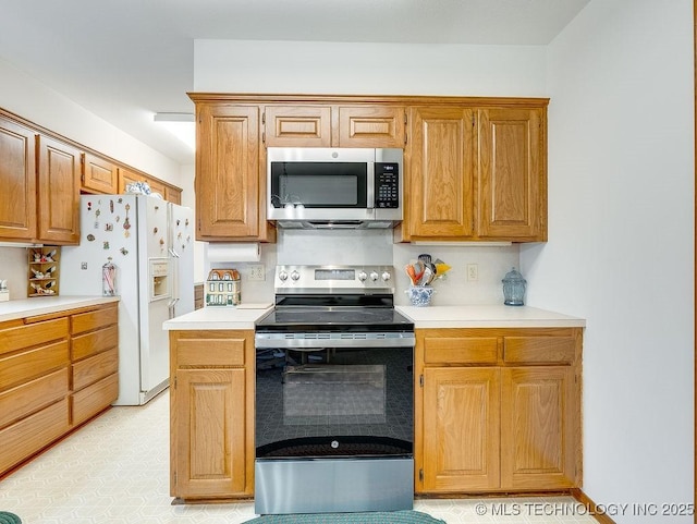 121 W 17th St, Ada, OK 74820 - kitchen featuring stainless steel appliances and light countertops